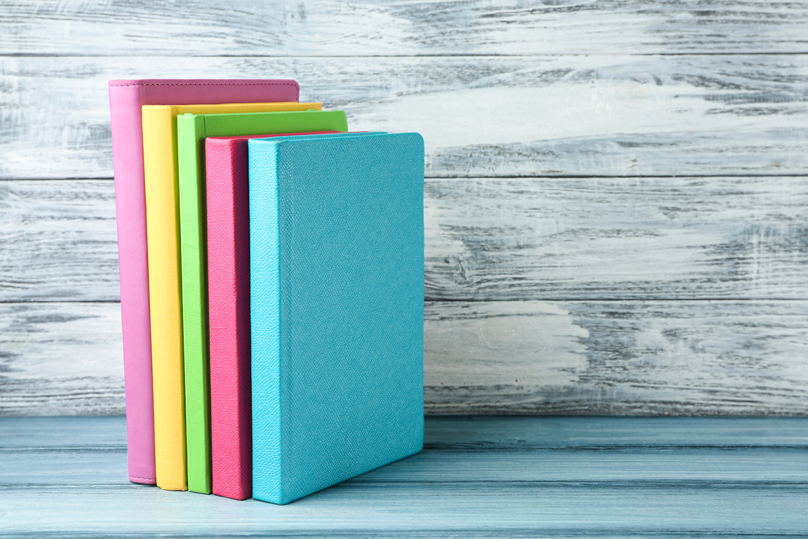 Books on Wooden Background