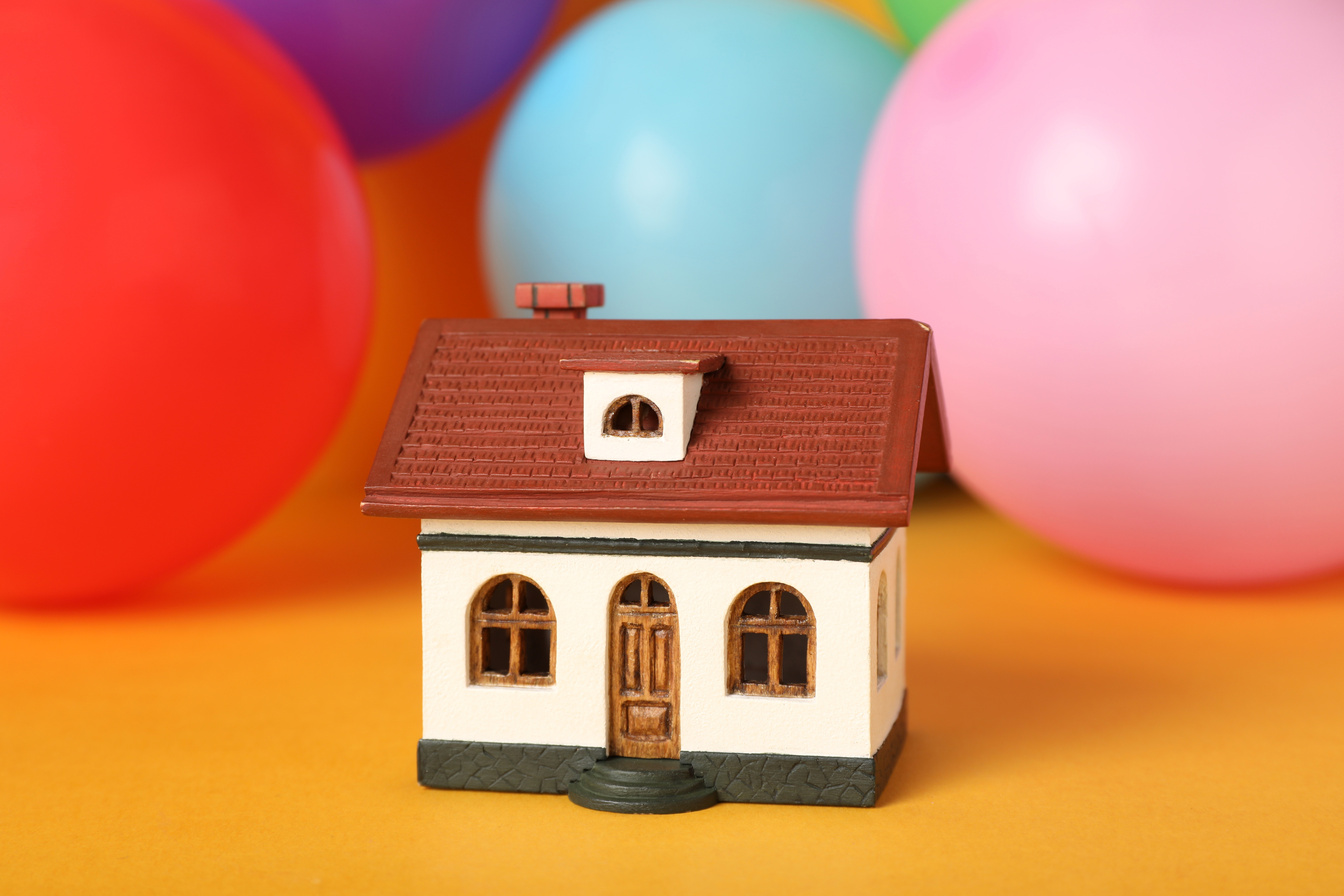 House Model and Balloons on Yellow Background. Housewarming Part
